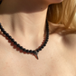 ONYX CROSS NECKLACE